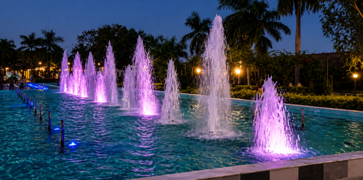 Illuminated dancing fountain jets engineered by Symphony Fountains